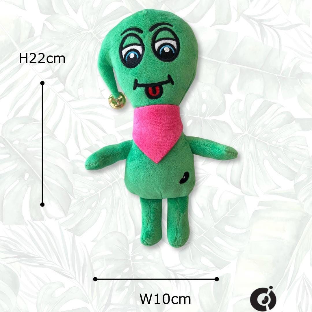 Green plush toy CwaZyBean Alien Blinkert the Sprinter plush toy, designed by CwaZyLeigh Creations. with a pink shirt on a white background, showing measurements.